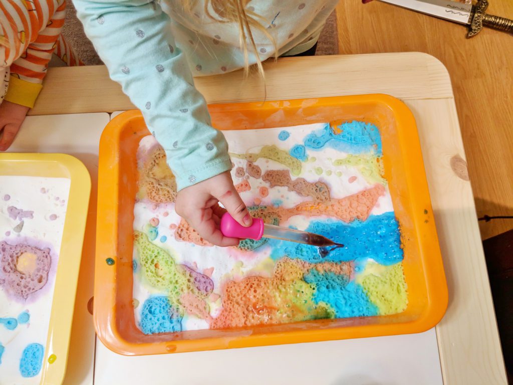 colourful fizzing baking soda and vinegar science experiment