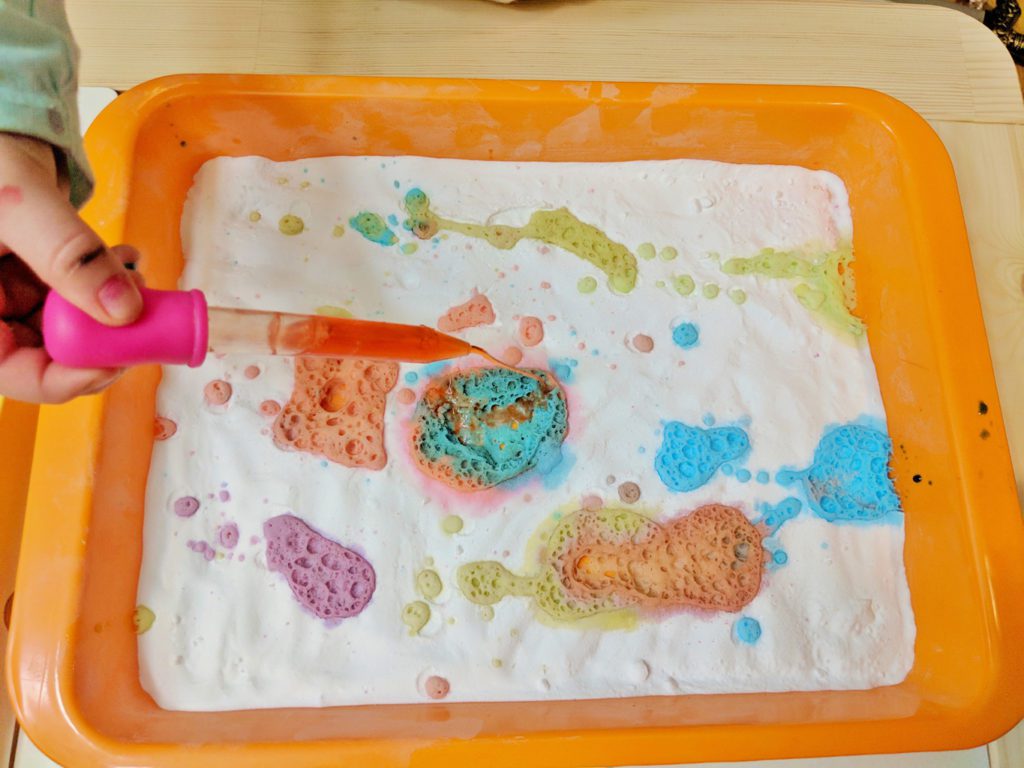 colourful fizzing baking soda and vinegar science experiment