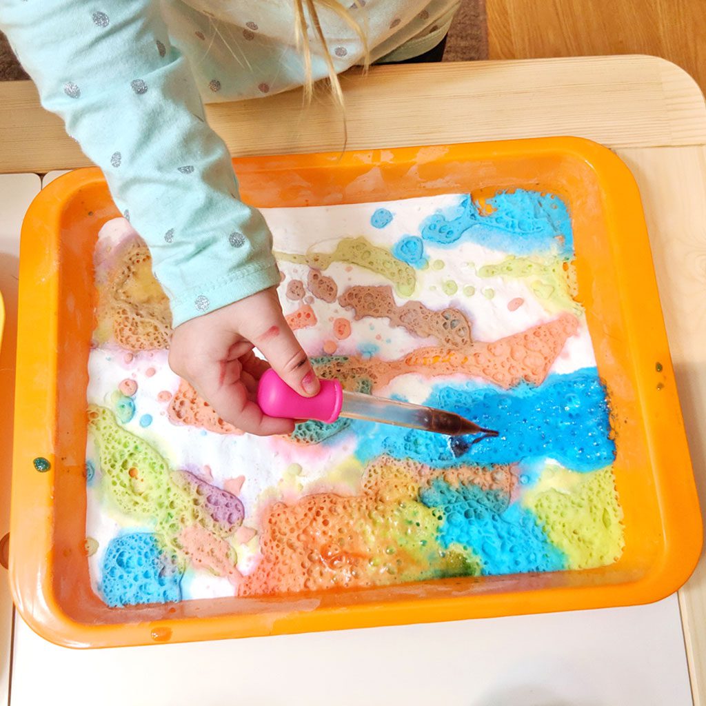 colourful fizzing baking soda and vinegar science experiment